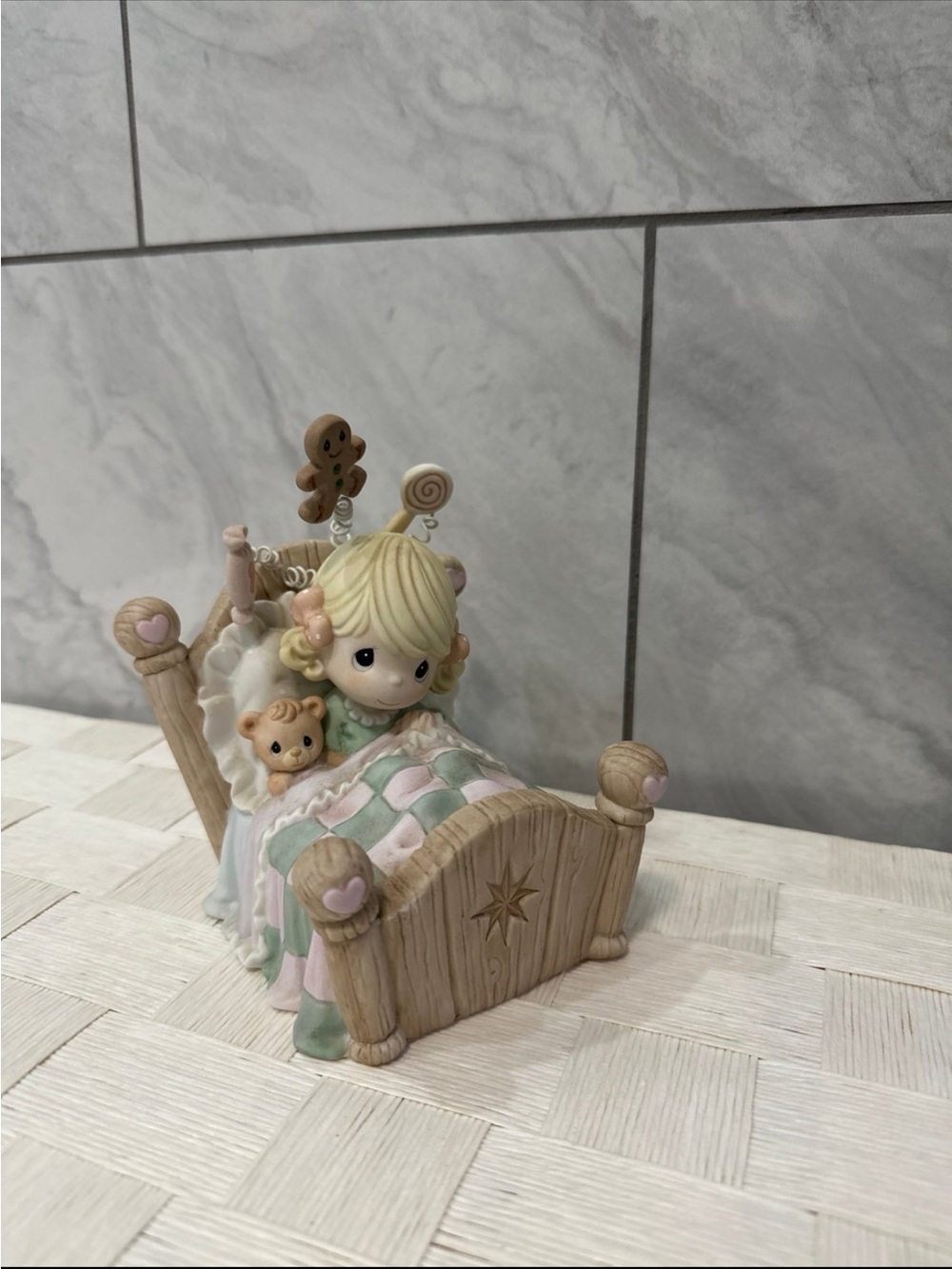 Precious Moments Blonde Girl Figurine with Pastel Pink & Mint Quilt